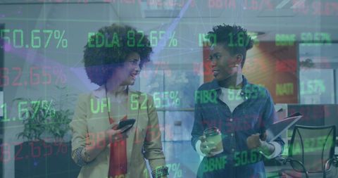 Diverse Businesswomen Analyzing Growth Stock Market Data in Office