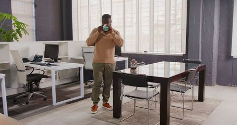 Businessman Exuding Confidence in Modern Office Environment