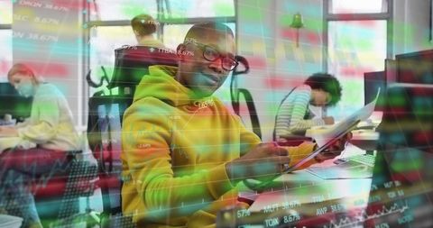 Finance professional reviewing documents in modern office