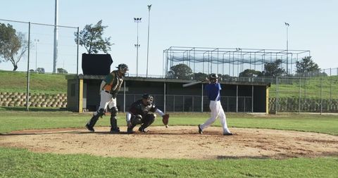 Intense baseball game action at home plate