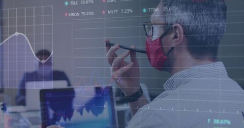 Businessman in Office Analyzing Tech Financial Data During Pandemic