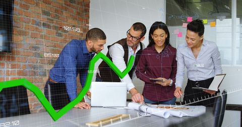 Diverse Team Analyzing Financial Data with Digital Graph Overlay in Modern Office