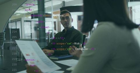 Office Team Collaborating on Data with Digital and Print Reports