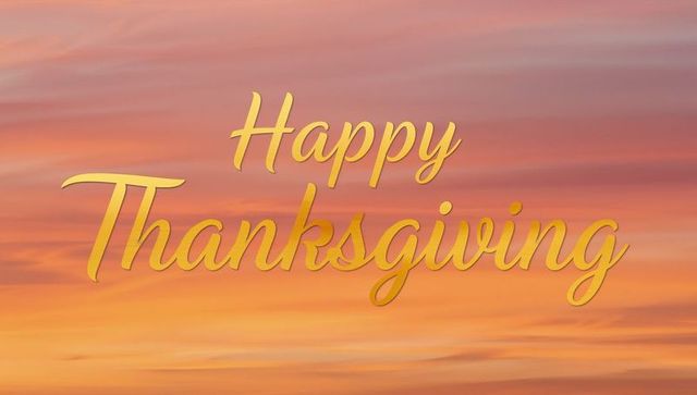 Golden Cursive Happy Thanksgiving Script Over Warm Sunset Background