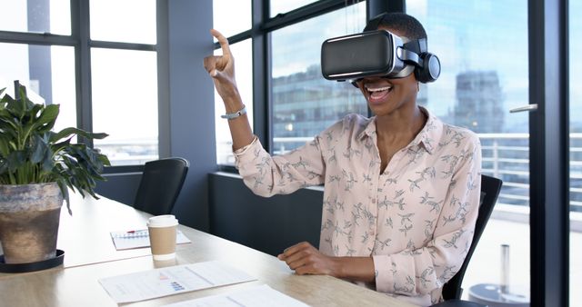 African American Businesswoman Using VR Headset in Office with Copy Space - Download Free Stock Images Pikwizard.com