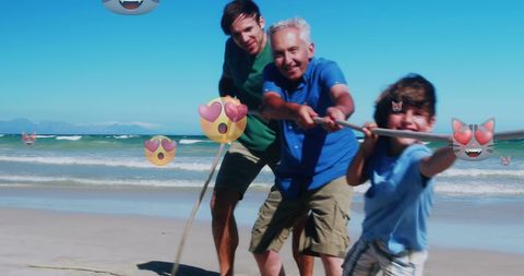 Generations Bonding with Tug-of-War Game on Beach - Download Free Stock Images Pikwizard.com