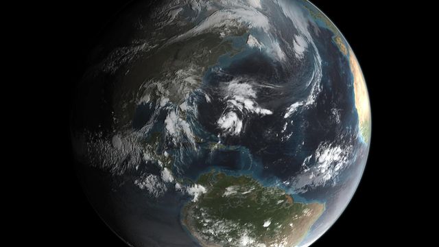 This image depicts a view of Earth captured by NASA's GPM satellite, showing Hurricane Joaquin as it forms. The clear view of the planet highlights the hurricane activity, which could impact the US East Coast. It is suitable for educational materials regarding space, weather patterns, earth science, and could be an excellent resource for news articles, research publications, and science presentations.