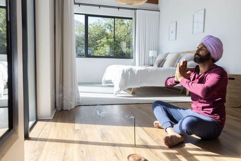 Indian Man Practicing Mindfulness Meditation at Home