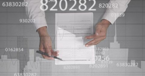 Executive Analyzing Financial Document with Digital Data Interface