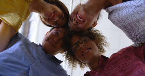 Diverse Team Embracing Unity in Office Circle