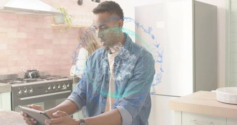 Man holding tablet navigating holographic global network above kitchen counter