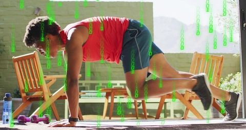 Athletic man doing mountain climbers on sunny patio outdoors