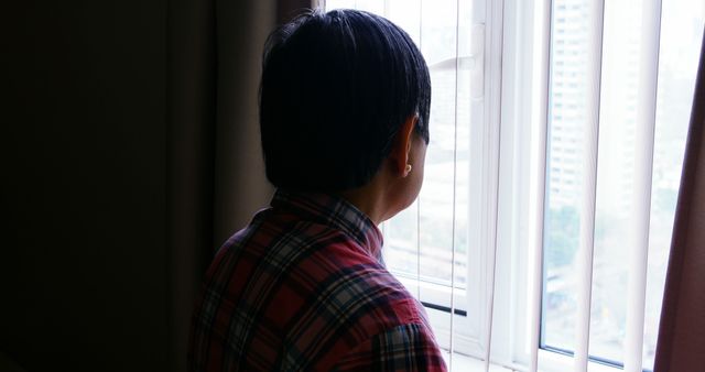 Person Wearing Plaid Shirt Looking Out Window - Download Free Stock Images Pikwizard.com