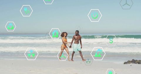 Couple Strolling Beach with Floating Sustainability Icons