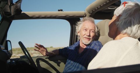 Senior Couple Enjoying Road Trip by the Beach Side