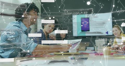 Innovative Team Analyzing Data in Technological Office