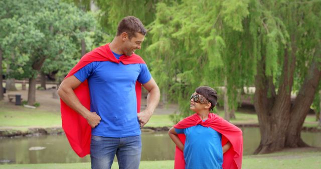 Father and Son Pretending to Be Superheroes in Park - Download Free Stock Images Pikwizard.com