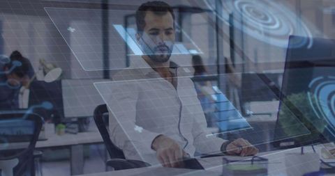 Bearded Professional Engaging with Futuristic Digital Interfaces in Tech Hub