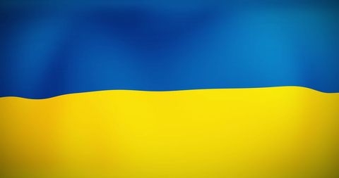 Vibrant Waving Flag of Ukraine under Blue Sky