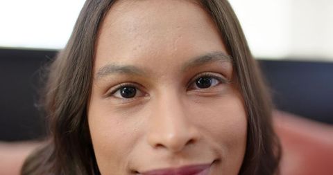 Intimate close-up african american woman looking into camera showing natural skin texture