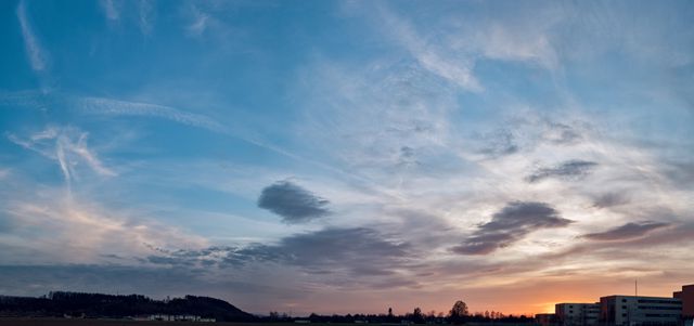 Panoramic Sunset Sky with Clouds Over Suburban Landscape - Download Free Stock Photos Pikwizard.com