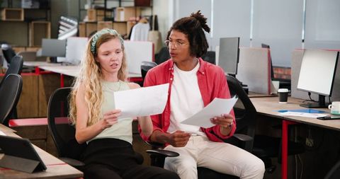 Collaborative Colleagues Discussing Ideas in Modern Office