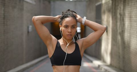 Focused Young African American Woman Prepares for Urban Workout - Download Free Stock Images Pikwizard.com