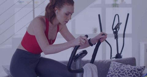 Exercise Enthusiast on Indoor Bike in Stylish Living Room
