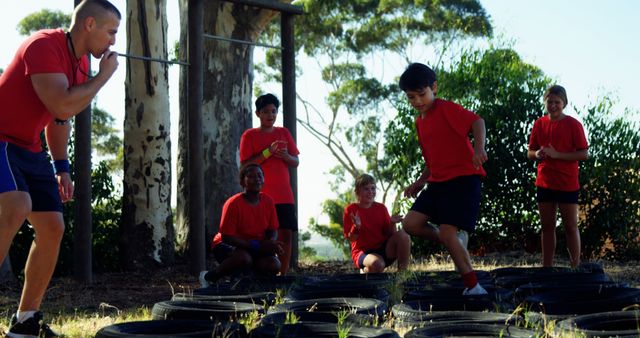 Children Participating in Outdoor Obstacle Course with Instructor - Download Free Stock Images Pikwizard.com