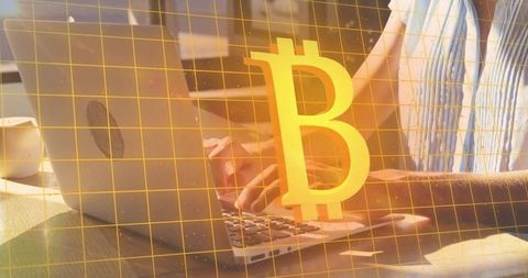 Sunlit remote worker typing on laptop with Bitcoin overlay for crypto finance concept