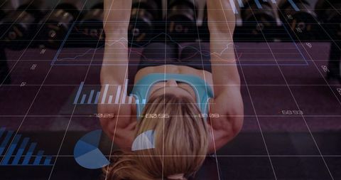 Female athlete performing bench dumbbell press with futuristic hud fitness data overlay