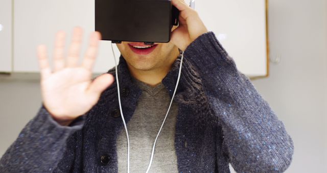 Man Using Virtual Reality Headset Enjoying VR Experience - Download Free Stock Images Pikwizard.com