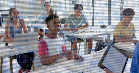 Teen students studying with laptops, tablets and binary code overlay for digital learning