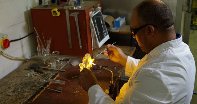 Glassblower in Lab Coat Crafting Glass Artwork with Torch - Download Free Stock Images Pikwizard.com