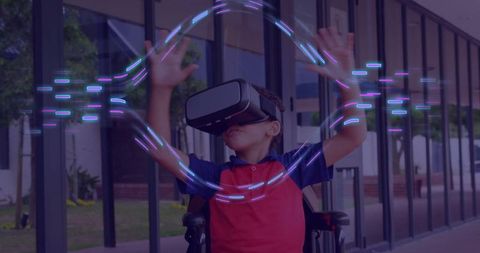 Schoolboy experiencing virtual reality with interactive effects