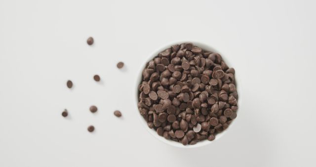 Overhead View of Chocolate Chips in Bowl on White Background - Download Free Stock Images Pikwizard.com