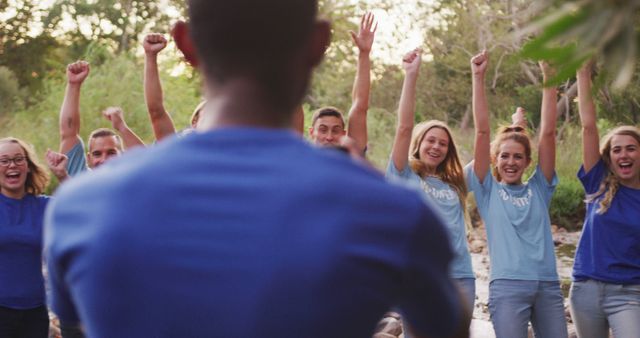 Diverse Group Celebrating Outdoors in Blue Shirts - Download Free Stock Images Pikwizard.com