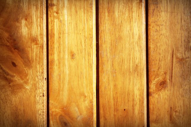 This image depicts a polished wooden surface with distinct grain patterns and a warm, natural brown color. Ideal for use in home decor design, product backgrounds, nature-themed websites, or as a backdrop in advertisements that require a rustic, earthy feel.