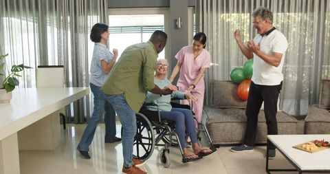 Welcoming New Physiotherapy Patient with Enthusiastic Group