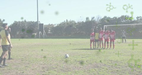 Taking free kick with molecular graphics overlay, soccer wall, sports science concept