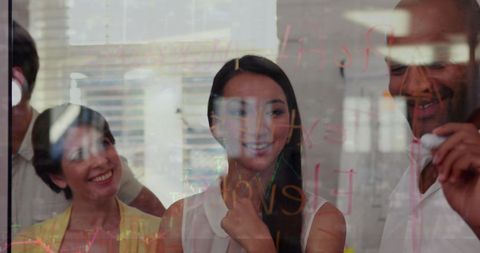 Diverse Team Analyzing Data Trends in Modern Office Environment