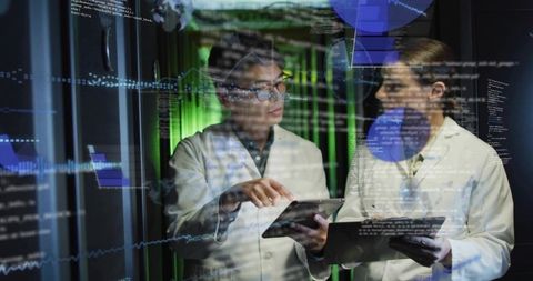 IT Engineers Collaborating with Tablets in Data Center for Real-Time Data Analytics