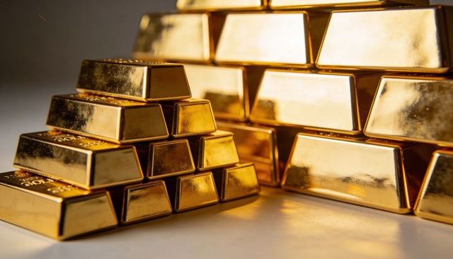 Shiny gold bars stacked in pyramid and large bullion pile reflecting luxury and wealth