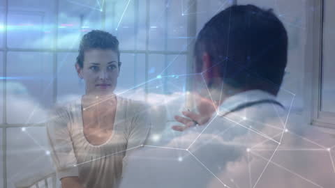 Doctor discussing with patient in futuristic healthcare setting