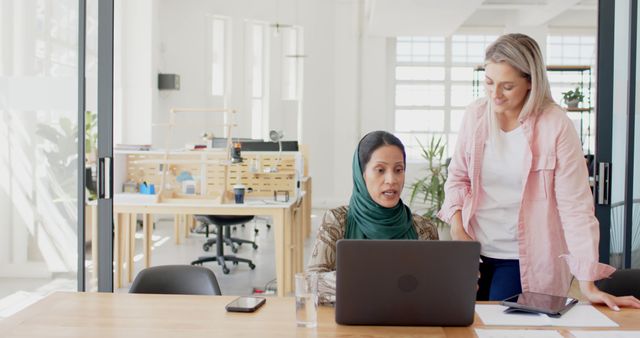 Two Businesswomen Collaborating in Modern Office - Download Free Stock Images Pikwizard.com