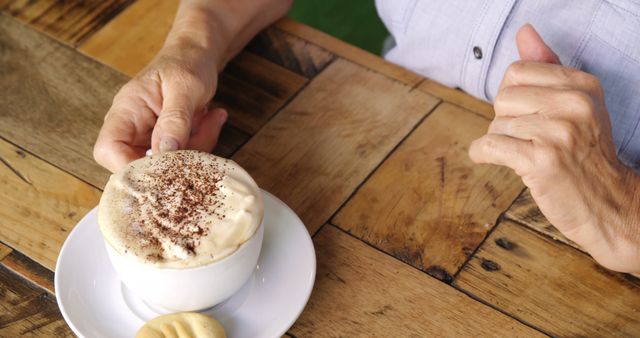 Senior Person Enjoying Coffee with Pastry at Rustic Cafe - Download Free Stock Images Pikwizard.com