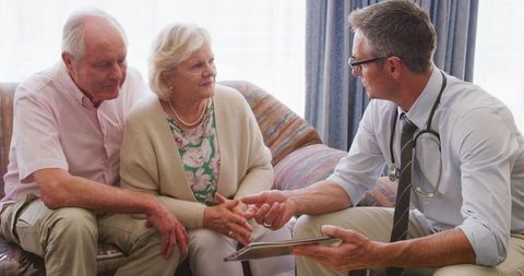 Elderly Couple Consult Doctor at Home During Pandemic