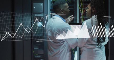 Engineers Analyzing Data Metrics in Modern Data Center