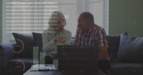 Senior Couple Analyzing Financial Data on Laptop