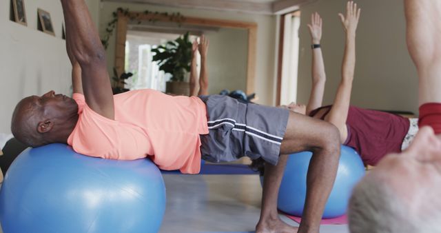 Seniors Exercising with Fitness Balls in Group Class Indoors - Download Free Stock Images Pikwizard.com